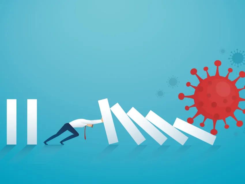 Geschäftsmann stoppt den Dominoeffekt von Coronavirus (COVID-19)